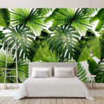 Fotomurales Exuberante estampado de hojas tropicales verdes.