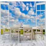 Fotomurales Ventana con cielo azul y nubes