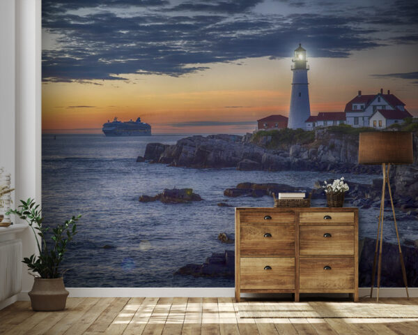 Faro en una costa rocosa con un crucero al fondo Fotomurales Faro en una costa rocosa con un crucero al fondo