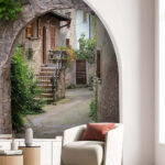 Fotomurales Encantador callejón de piedra con arco