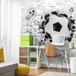 Fotomurales Los balones de fútbol atraviesan la pared