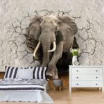 Fotomurales Elefante irrumpiendo en la pared.