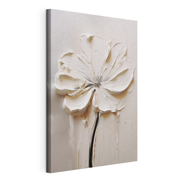 Cuadros Una flor blanca tallada en una superficie blanca