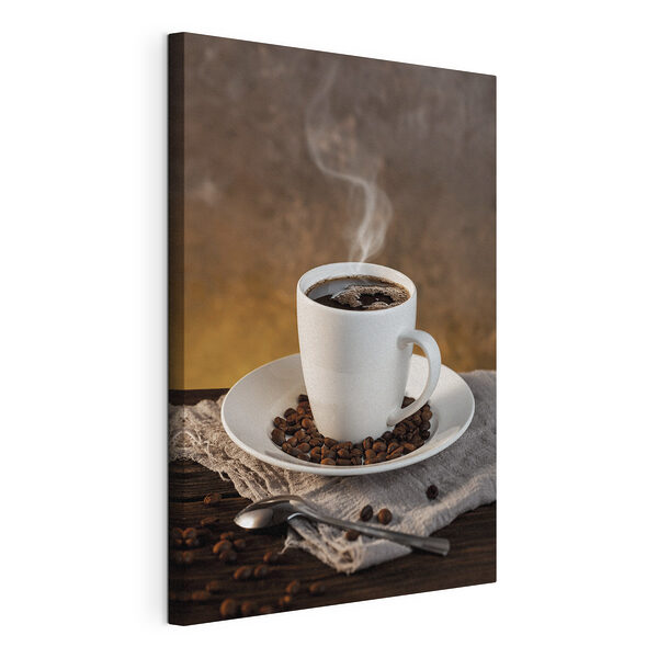 Cuadros Una taza de café en un plato con granos de café