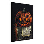 Cuadros Calabaza con una cara encima de un libro