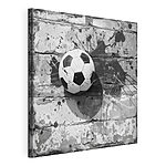 Cuadros Balón de fútbol contra una pared de ladrillos