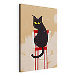Cuadros Gato negro sentado en una silla roja