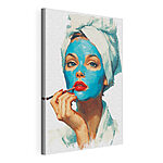 Cuadros Mujer con una mascarilla azul puesta
